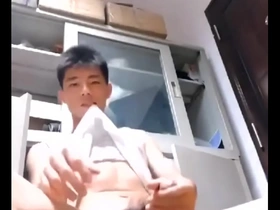 An Asian woman pleasuring herself.