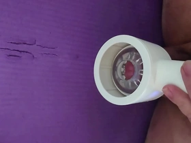 Japanese gay masturbates with a toy and has an orgasm.