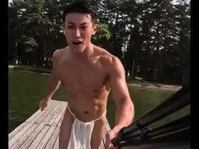 Muscular Japanese friend shows off his body