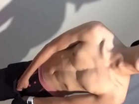 Gay sports club member flaunts his large penis on camera.