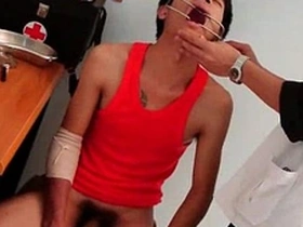 Young gay twink in doctor’s uniform gives rectal examination.