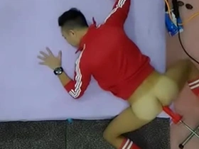 Red fun with buttmachine and dildo in gay Asian video.