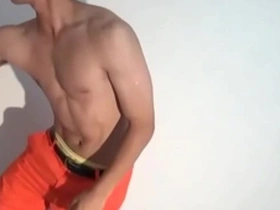 Young and straight sports enthusiast shows off his muscles and short hair.
