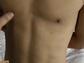 Asian boy in bondage gets a handjob and cums hard