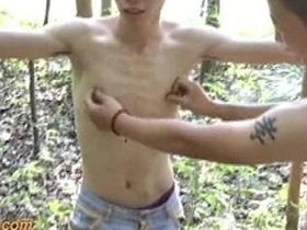 Asian boy tied up outdoors for some fun
