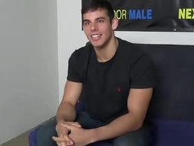 A single, attractive man with a tattoo masturbates during an audition