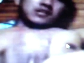 A single Asian man pleasuring himself.