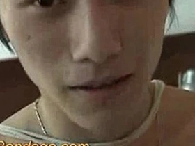 Asian twink BDSM boy gets a handjob and cum on his body.